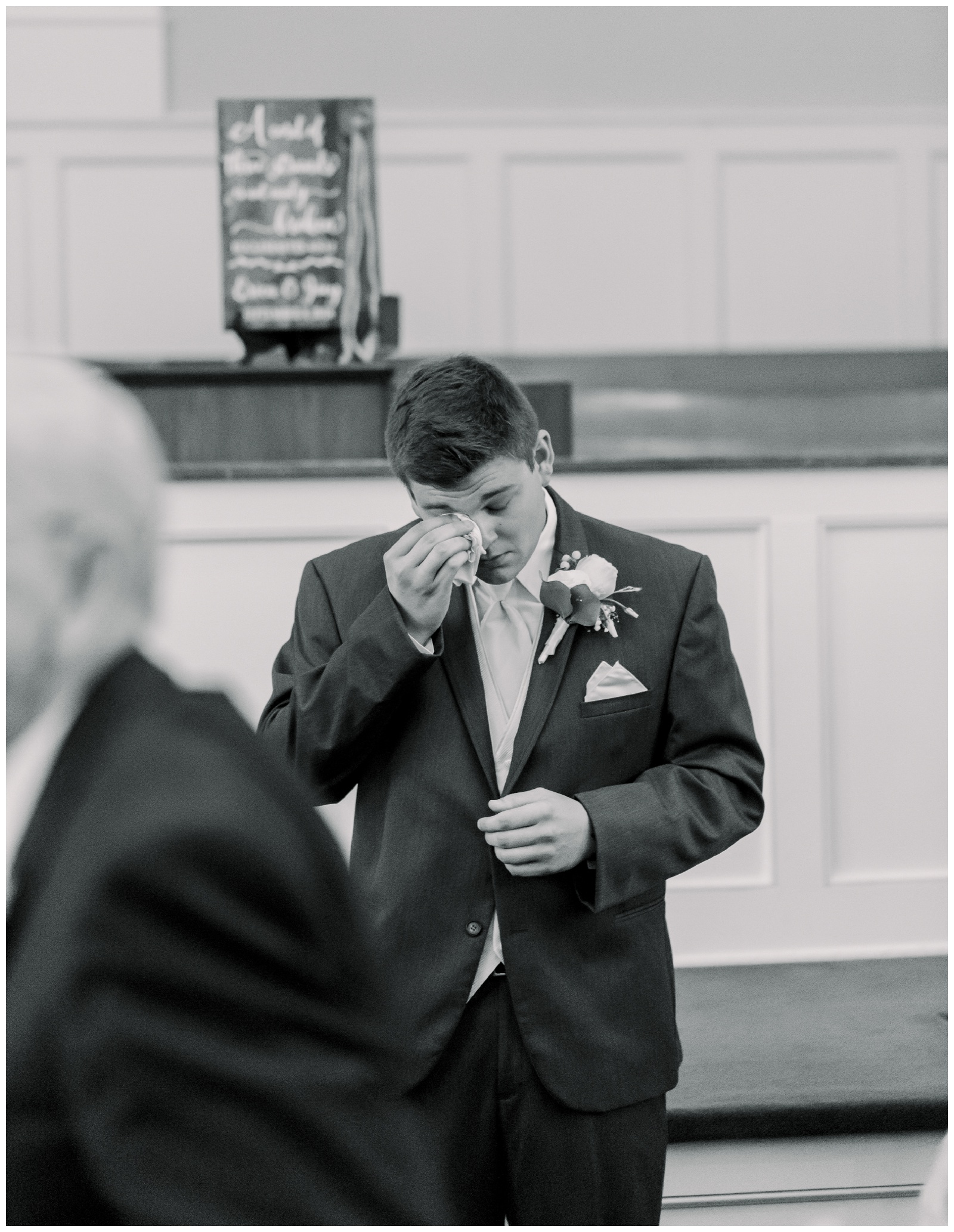 groom at alter wiping tears from his eyes, atlanta ga wedding photographer